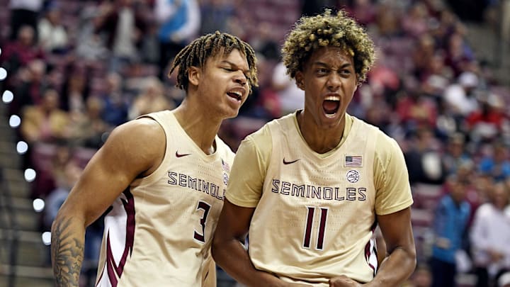 Jan 28, 2023; Tallahassee, Florida, USA; Florida State Seminoles forward Cameron Corhen (3) and forward Baba Miller (11) celebrate after a big play in the second half against the Clemson Tigers at Donald L. Tucker Center. Mandatory Credit: Melina Myers-Imagn Images