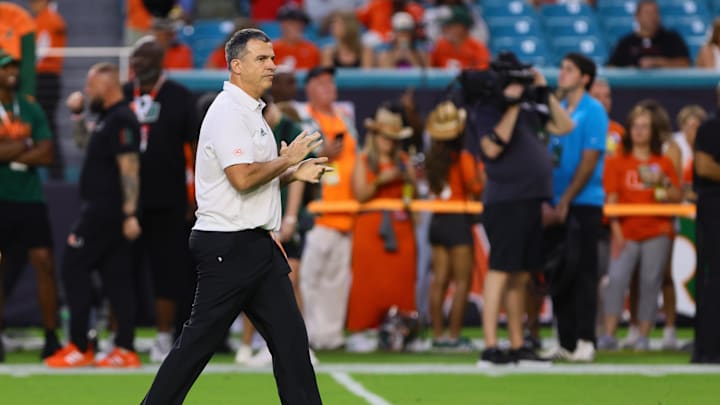 Oct 26, 2024; Miami Gardens, Florida, USA; Miami Hurricanes head coach Mario Cristobal reacts on the field before the game against the Florida State Seminoles at Hard Rock Stadium. Mandatory Credit: Sam Navarro-Imagn Images