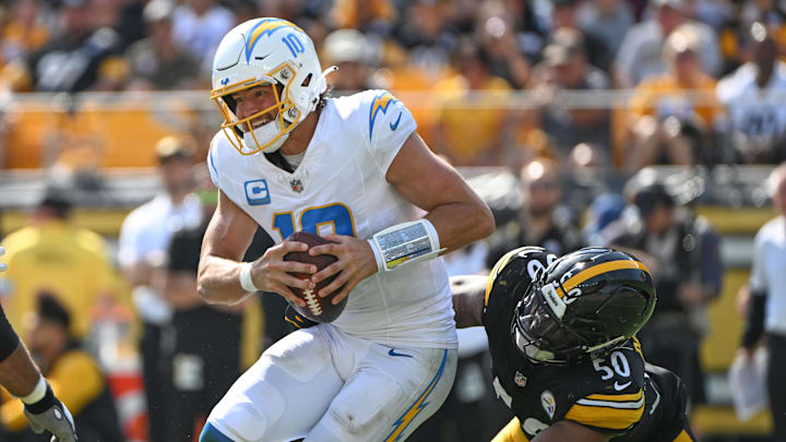 Sep 22, 2024; Pittsburgh, Pennsylvania, USA; Pittsburgh Steelers linebacker Elandon Roberts (50) sacks Los Angeles Chargers quarterback Justin Herbert (10) during the third quarter at Acrisure Stadium. Mandatory Credit: Barry Reeger-Imagn Images