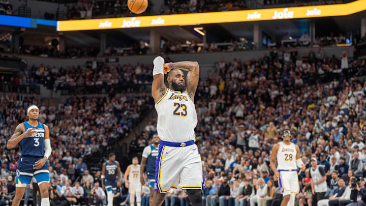 Apr 27, 2025; Minneapolis, Minnesota, USA; Los Angeles Lakers forward LeBron James (23) throws the ball over his head after a backcourt violation against the Los Angeles Lakers in the third quarter during game four of first round for the 2025 NBA Playoffs at Target Center. Mandatory Credit: Matt Blewett-Imagn Images