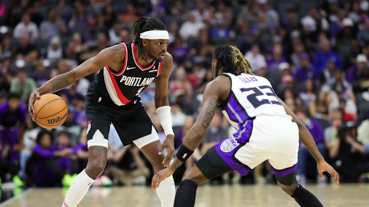Oct 13, 2024; Sacramento, California, USA; Portland Trail Blazers forward Jerami Grant (9) controls the ball against Sacramento Kings guard Keon Ellis (23) during the first quarter at Golden 1 Center. Mandatory Credit: Sergio Estrada-Imagn Images