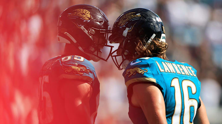 Jacksonville Jaguars quarterback Trevor Lawrence (16) and tight end Brenton Strange (85) celebrate a touchdown score during the fourth quarter of an NFL football matchup at EverBank Stadium, Sunday, Sept. 21, 2025, in Jacksonville, Fla. The Jaguars defeated the Texans 17-10. [Corey Perrine/Florida Times-Union]