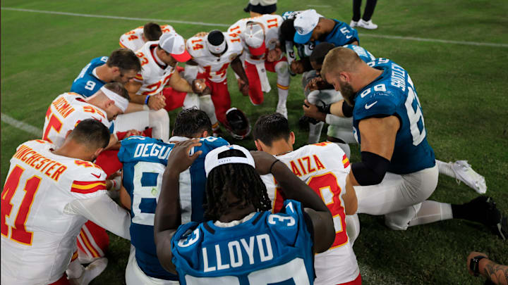 Jacksonville Jaguars linebacker Devin Lloyd (33) prays with other players after the game of a preseason NFL football game Saturday, Aug. 10, 2024 at EverBank Stadium in Jacksonville, Fla. The Jacksonville Jaguars defeated the Kansas City Chiefs 26-13. [Corey Perrine/Florida Times-Union]
