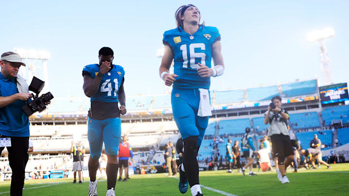 Jacksonville Jaguars defensive end Josh Hines-Allen (41) and quarterback Trevor Lawrence (16) run off the field after the game of an NFL football game at EverBank Stadium, Sunday, Nov. 16, 2025 in Jacksonville, Fla. The Jacksonville Jaguars defeated the Los Angeles Chargers 35-6. [Corey Perrine/Florida Times-Union]