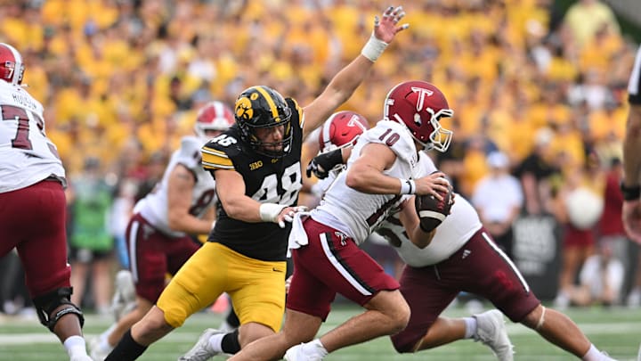 Sep 14, 2024; Iowa City, Iowa, USA; Iowa Hawkeyes defensive lineman Max Llewellyn (48) chases Troy Trojans quarterback Tucker Kilcrease (10) during the fourth quarter at Kinnick Stadium. Mandatory Credit: Jeffrey Becker-Imagn Images