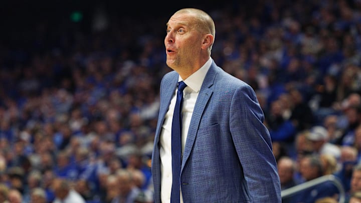 Nov 19, 2024; Lexington, Kentucky, USA; Kentucky Wildcats head coach Mark Pope celebrates from the sideline during the first half against the Lipscomb Bisons at Rupp Arena at Central Bank Center. Mandatory Credit: Jordan Prather-Imagn Images
