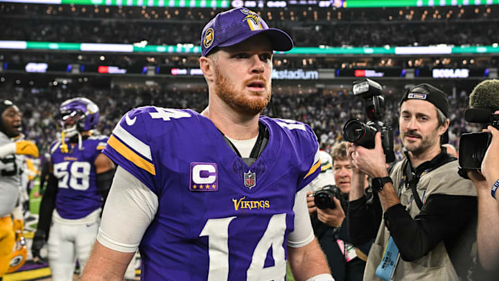 Dec 29, 2024; Minneapolis, Minnesota, USA; Minnesota Vikings quarterback Sam Darnold (14) walks off the field after the game against the Green Bay Packers at U.S. Bank Stadium.