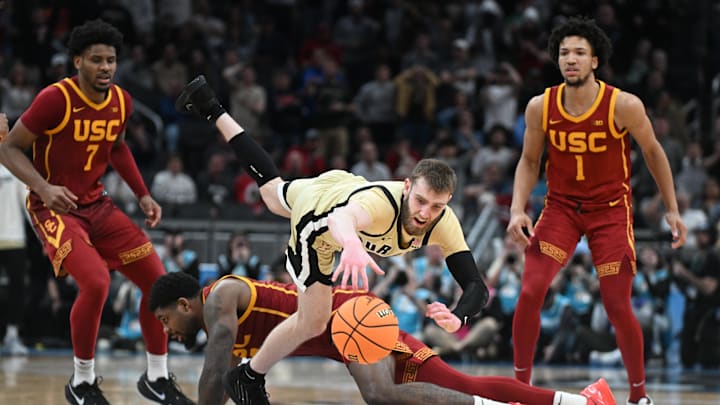 Mar 13, 2025; Indianapolis, IN, USA; Purdue Boilermakers guard Braden Smith (3) is fouled by USC Trojans forward Rashaun Agee (12) during the second half at Gainbridge Fieldhouse. Mandatory Credit: Robert Goddin-Imagn Images