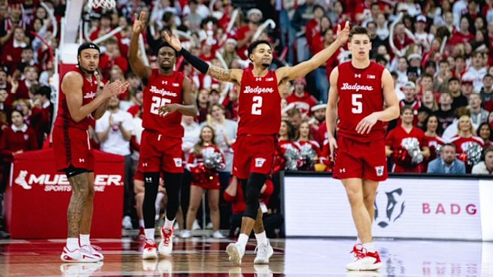 Nick Boyd (2) hypes up the crowd as Braeden Carringon (left), John Blackwell (background) and Jack Janicki (5) look on.