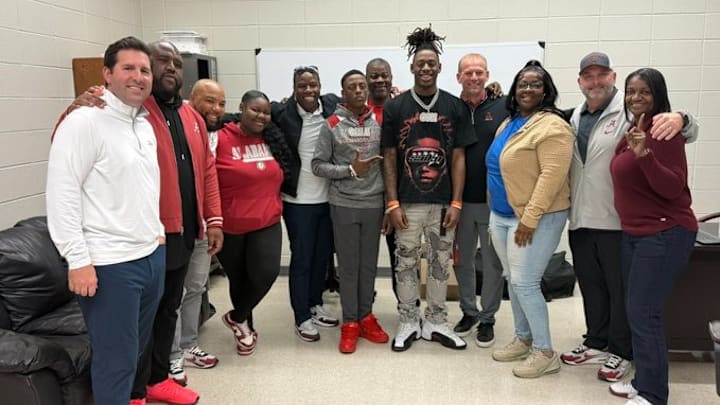 2026 wide receiver Cederian Morgan alongside members of the Alabama coaching staff. 