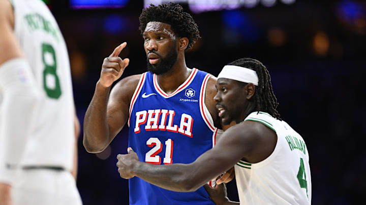 Nov 8, 2023; Philadelphia, Pennsylvania, USA; Boston Celtics guard Jrue Holiday (4) defends Philadelphia 76ers center Joel Embiid (21) in the third quarter at Wells Fargo Center. Mandatory Credit: Kyle Ross-Imagn Images