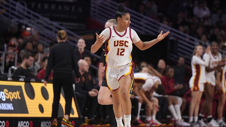 Dec 29, 2024; Los Angeles, California, USA; Southern California Trojans guard JuJu Watkins (12) reacts in the second half against the Michigan Wolverines at Galen Center. Mandatory Credit: Kirby Lee-Imagn Images