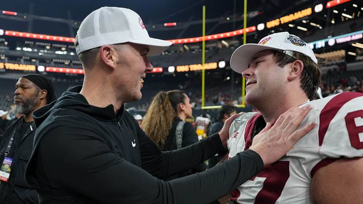 Dec 27, 2024; Las Vegas, NV, USA; Southern California Trojans head coach Lincoln Riley embraces offensive lineman Kilian O'Connor (67) after the game against the Texas A&M Aggies at Allegiant Stadium. Mandatory Credit: Kirby Lee-Imagn Images Dec 27, 2024; Las Vegas, NV, USA; Southern California Trojans head coach Lincoln Riley embraces offensive lineman Kilian O'Connor (67) after the game against the Texas A&M Aggies at Allegiant Stadium. Mandatory Credit: Kirby Lee-Imagn Images