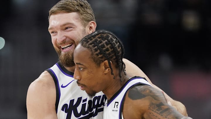 Dec 6, 2024; San Antonio, Texas, USA; Sacramento Kings center Domantas Sabonis (11) and forward DeMar DeRozan (10) embrace before a game the San Antonio Spurs at Frost Bank Center. Mandatory Credit: Scott Wachter-Imagn Images