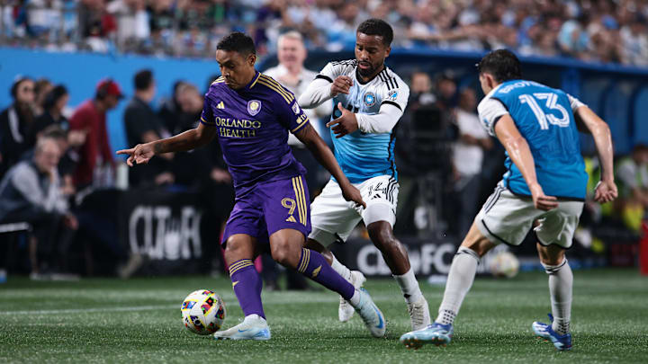 Nov 1, 2024; Charlotte, North Carolina, USA;  Orlando City forward Luis Muriel (9) controls the ball against Charlotte FC defender Nathan Byrne (14) during the second half at Bank of America Stadium. Mandatory Credit: Scott Kinser-Imagn Images