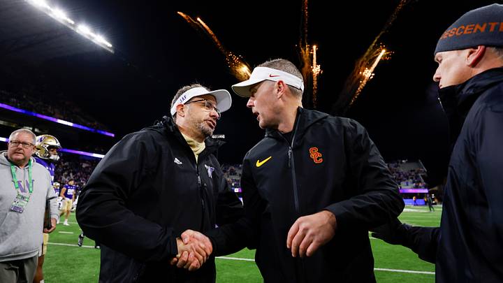 Huskies coach Jedd Fisch, left, shakes hands with USC coach Lincoln Riley following their 2024 game in Seattle. Huskies coach Jedd Fisch, left, shakes hands with USC coach Lincoln Riley following their 2024 game in Seattle.