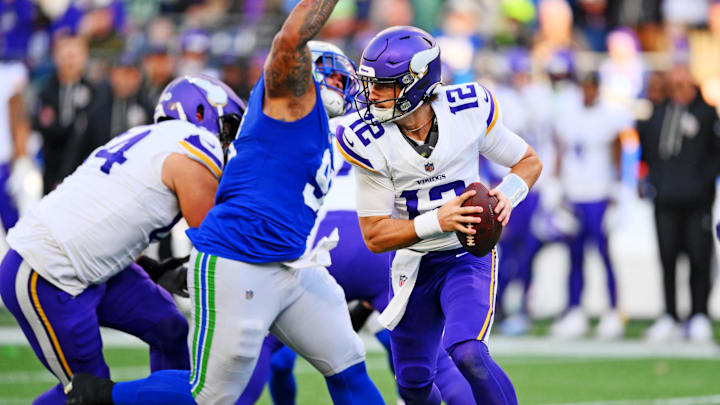 Nov 30, 2025; Seattle, Washington, USA; Minnesota Vikings quarterback Max Brosmer (12) runs the ball during the first half against the Seattle Seahawks at Lumen Field.