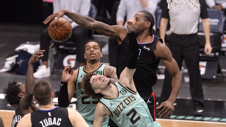  Los Angeles Clippers guard forward Kawhi Leonard (2) stops Charlotte Hornets guard LaMelo Ball (2) as he drives to the basket during the second half at the Spectrum Center. Mandatory Credit: Sam Sharpe-Imagn Images