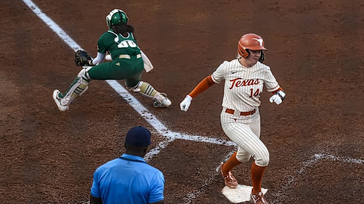 Texas Longhorns catcher Reese Atwood (14) beats the ball home for a score during the game against South Florida on the first day of the Longhorn Invitational on Friday, Feb. 28, 2025 in Austin.
