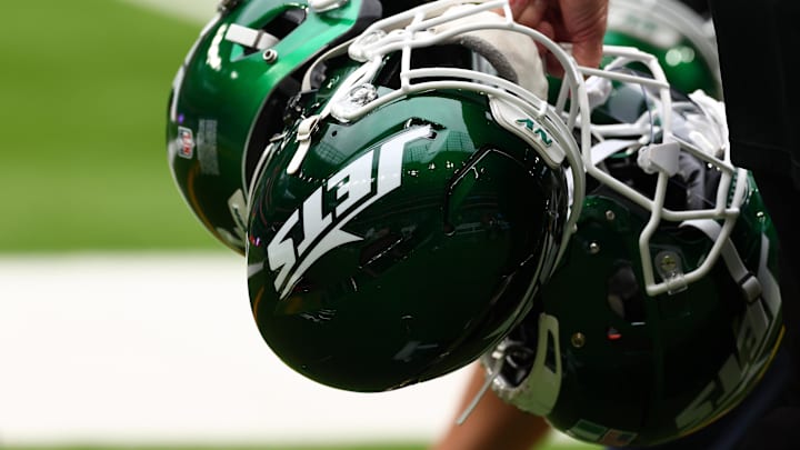 Oct 6, 2024; Tottenham, ENG; New York Jets helmets are held by staff before the match against Minnesota Vikings at Tottenham Hotspur Stadium. Mandatory Credit: Shaun Brooks-Imagn Images Oct 6, 2024; Tottenham, ENG; New York Jets helmets are held by staff before the match against Minnesota Vikings at Tottenham Hotspur Stadium. Mandatory Credit: Shaun Brooks-Imagn Images