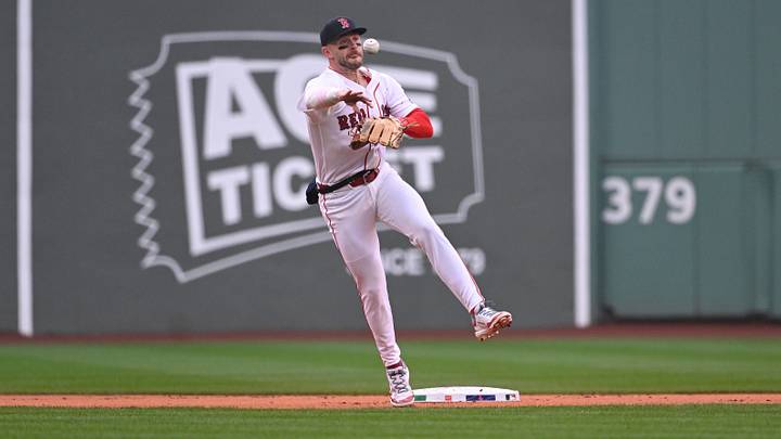 Apr 5, 2026; Boston, Massachusetts, USA; Boston Red Sox shortstop Trevor Story (10) throws the ball to first base for a double play against the San Diego Padres during the first inning at Fenway Park. Mandatory Credit: Eric Canha-Imagn Images