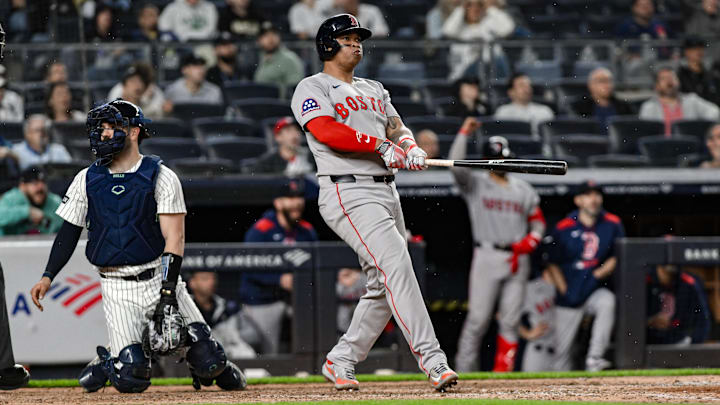Bronx, New York, USA; Boston Red Sox designated hitter Rafael Devers (11) reacts after hitting a solo home run against the New York Yankees during the ninth inning at Yankee Stadium. Bronx, New York, USA; Boston Red Sox designated hitter Rafael Devers (11) reacts after hitting a solo home run against the New York Yankees during the ninth inning at Yankee Stadium.