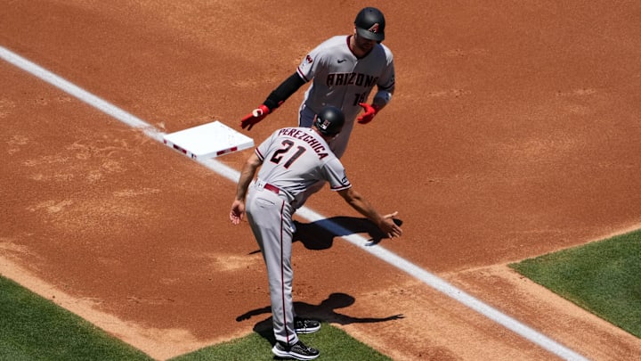 Jul 2, 2023; Anaheim, California, USA; Arizona Diamondbacks catcher Carson Kelly (18) is congratulated by third base coach Tony Perezchica (21) after hitting a two-run home run in the second inning against the Los Angeles Angels at Angel Stadium. Jul 2, 2023; Anaheim, California, USA; Arizona Diamondbacks catcher Carson Kelly (18) is congratulated by third base coach Tony Perezchica (21) after hitting a two-run home run in the second inning against the Los Angeles Angels at Angel Stadium.