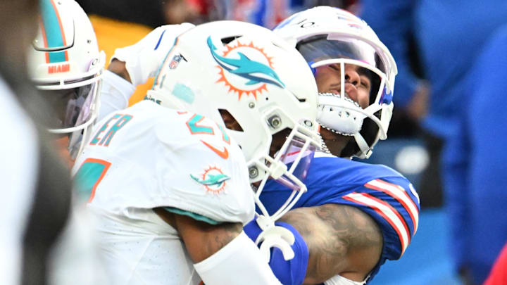 Buffalo Bills wide receiver Keon Coleman (0) is hit in the helmet by Miami Dolphins safety Jordan Poyer (21) resulting in a personal foul penalty on Poyer in the fourth quarter at Highmark Stadium. Buffalo Bills wide receiver Keon Coleman (0) is hit in the helmet by Miami Dolphins safety Jordan Poyer (21) resulting in a personal foul penalty on Poyer in the fourth quarter at Highmark Stadium.