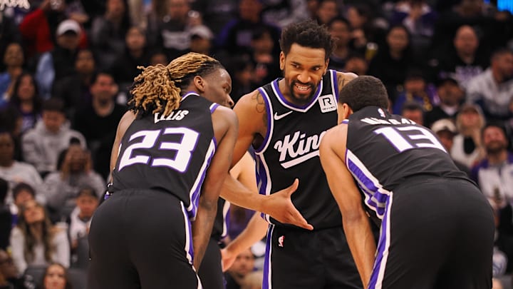 Feb 8, 2025; Sacramento, California, USA; Sacramento Kings guard Malik Monk (0) speaks with teammates guard Keon Ellis (23) and forward Keegan Murray (13) between plays against the New Orleans Pelicans during the third quarter at Golden 1 Center. Mandatory Credit: Kelley L Cox-Imagn Images