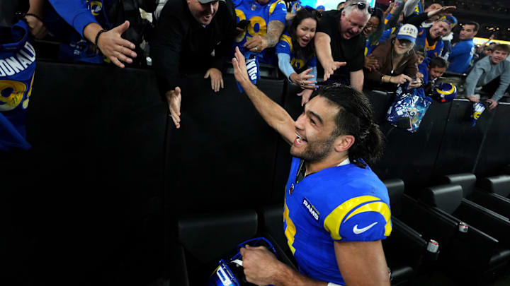 Los Angeles Rams receiver Puka Nacua (17) high-fives fans after their 27-9 playoff win over the Minnesota Vikings at State Farm Stadium on Jan. 13, 2025, in Glendale.