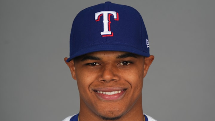 Feb 19, 2025; Surprise, AZ, USA; Texas Rangers pitcher Winston Santos (84) poses for a photo during Media Day at Surprise Stadium. Feb 19, 2025; Surprise, AZ, USA; Texas Rangers pitcher Winston Santos (84) poses for a photo during Media Day at Surprise Stadium.