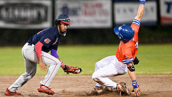 HYANNIS 8/10/23 Zach Ehrhard of Hyannis arrives at second as Joshua Kuroda-Grauer takes the outfield throw. Cape League baseball HYANNIS 8/10/23 Zach Ehrhard of Hyannis arrives at second as Joshua Kuroda-Grauer takes the outfield throw. Cape League baseball