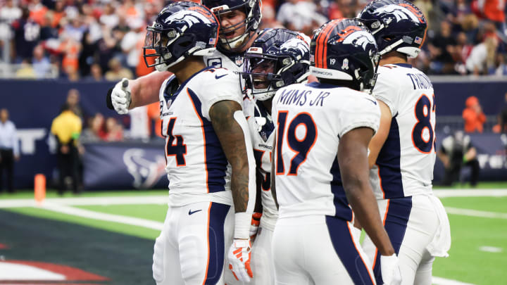 Dec 3, 2023; Houston, Texas, USA; Denver Broncos wide receiver Courtland Sutton (14) celebrates his touchdown reception with teammates against the Houston Texans in the second half at NRG Stadium. Mandatory Credit: Thomas Shea-USA TODAY Sports