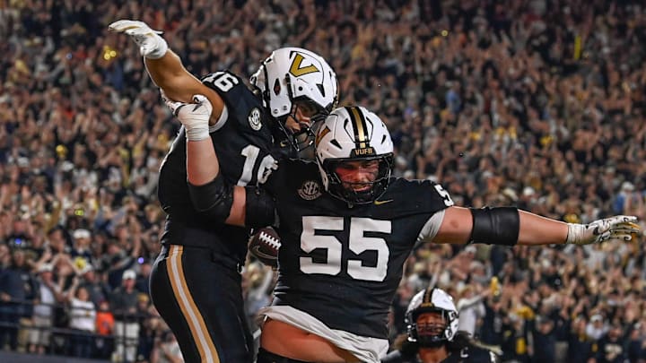Vanderbilt tight end Cole Spence (16) celebrates his touchdown with offensive lineman Bryce Henderson (55) during overtime at FirstBank Stadium in Nashville, Tenn., Saturday, Nov. 8, 2025.
