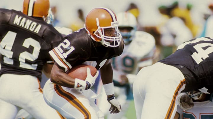 Oct 8, 1989; Miami, FL, USA; FILE PHOTO; Cleveland Browns kick returner Eric Metcalf (21) carries the ball against the Miami Dolphins at Joe Robbie Stadium during the 1989 season. Mandatory Credit: RVR Photos-Imagn Images