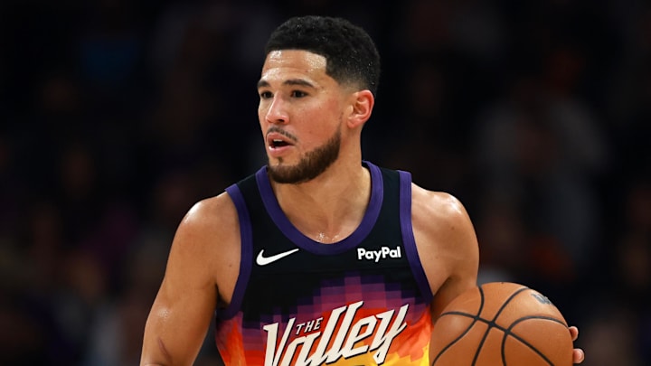 Jan 9, 2026; Phoenix, Arizona, USA; Phoenix Suns guard Devin Booker (1) against the New York Knicks at Mortgage Matchup Center. Mandatory Credit: Mark J. Rebilas-Imagn Images