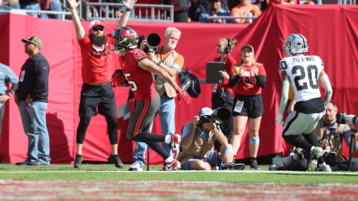 Dec 8, 2024; Tampa, Florida, USA; Tampa Bay Buccaneers wide receiver Jalen McMillan (15) scores a touchdown during the first half against the Las Vegas Raiders at Raymond James Stadium. Mandatory Credit: Kim Klement Neitzel-Imagn Images Dec 8, 2024; Tampa, Florida, USA; Tampa Bay Buccaneers wide receiver Jalen McMillan (15) scores a touchdown during the first half against the Las Vegas Raiders at Raymond James Stadium. Mandatory Credit: Kim Klement Neitzel-Imagn Images