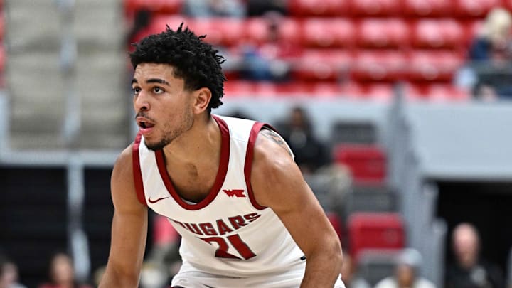 Oct 25, 2025; Pullman, WA, USA; Washington State Cougars guard Ace Glass Lll (21) controls the ball against the New Mexico Lobos in the second half at Friel Court at Beasley Coliseum. Mandatory Credit: James Snook-Imagn Images Oct 25, 2025; Pullman, WA, USA; Washington State Cougars guard Ace Glass Lll (21) controls the ball against the New Mexico Lobos in the second half at Friel Court at Beasley Coliseum. Mandatory Credit: James Snook-Imagn Images