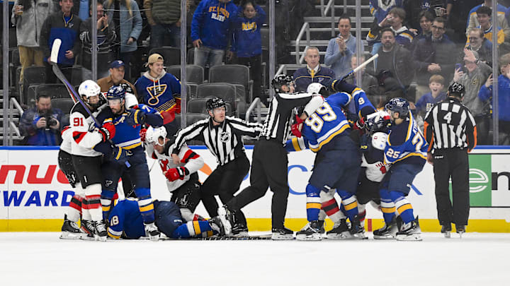 Dec 17, 2024; St. Louis, Missouri, USA;  St. Louis Blues and the New Jersey Devils get in a scuffle during the third period at Enterprise Center. Mandatory Credit: Jeff Curry-Imagn Images