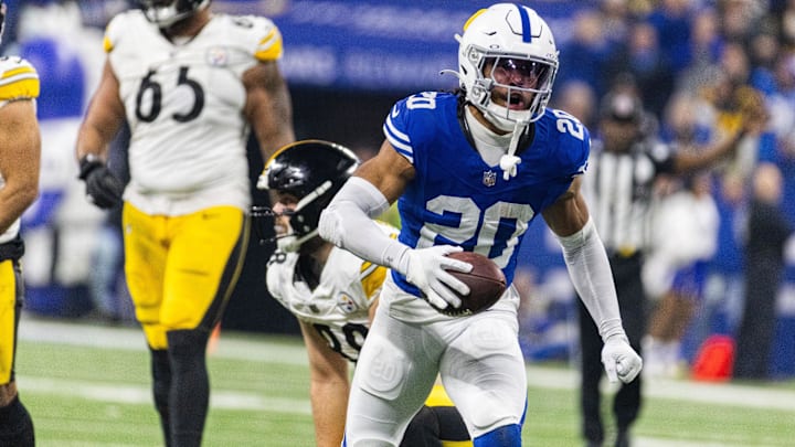 Dec 16, 2023; Indianapolis, Indiana, USA; Indianapolis Colts safety Nick Cross (20) celebrates his interception in the first half against the Pittsburgh Steelers at Lucas Oil Stadium. Mandatory Credit: Trevor Ruszkowski-Imagn Images