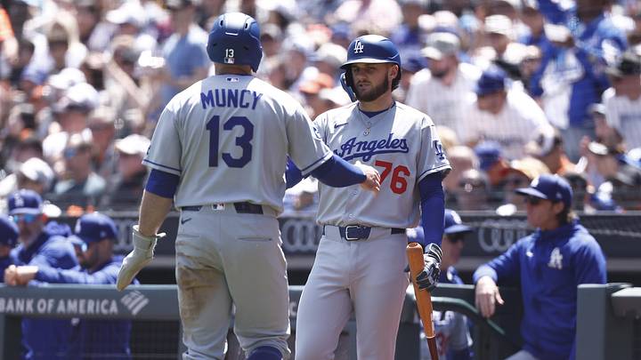Apr 23, 2026; San Francisco, California, USA; Los Angeles Dodgers third baseman Max Muncy (13) high fives second baseman Alex Freeland (76) after a scoring a run against the San Francisco Giants during the second inning at Oracle Park. Mandatory Credit: Kelley L Cox-Imagn Images