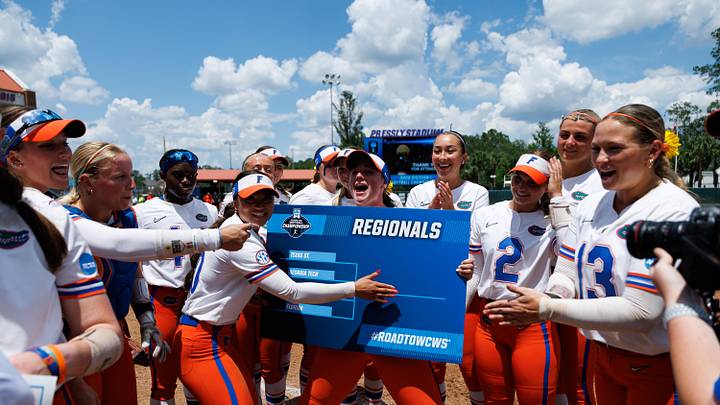 May 17, 2026; Gainesville, FL, USA; Florida Gators infielder Gabi Comia (10) and Florida Gators pitcher Caroline Stanton (1) celebrate with teammates placing the Florida sticker on the NCAA Regionals bracket after the game against the Georgia Tech Yellow Jackets at Katie Seashole Pressly Stadium. Mandatory Credit: Matt Pendleton-Imagn Images May 17, 2026; Gainesville, FL, USA; Florida Gators infielder Gabi Comia (10) and Florida Gators pitcher Caroline Stanton (1) celebrate with teammates placing the Florida sticker on the NCAA Regionals bracket after the game against the Georgia Tech Yellow Jackets at Katie Seashole Pressly Stadium. Mandatory Credit: Matt Pendleton-Imagn Images