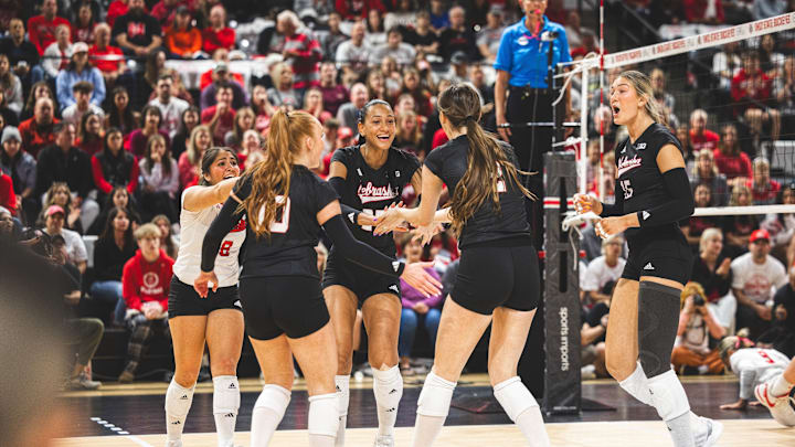 Nebraska volleyball players celebrate a point at Ohio State.