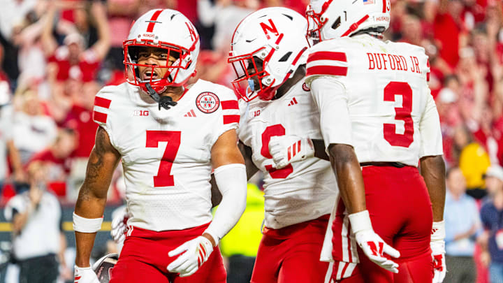 Nebraska Cornhuskers defensive back Malcolm Hartzog Jr. celebrates with linebacker Vincent Shavers Jr. and defensive back Marques Buford Jr.