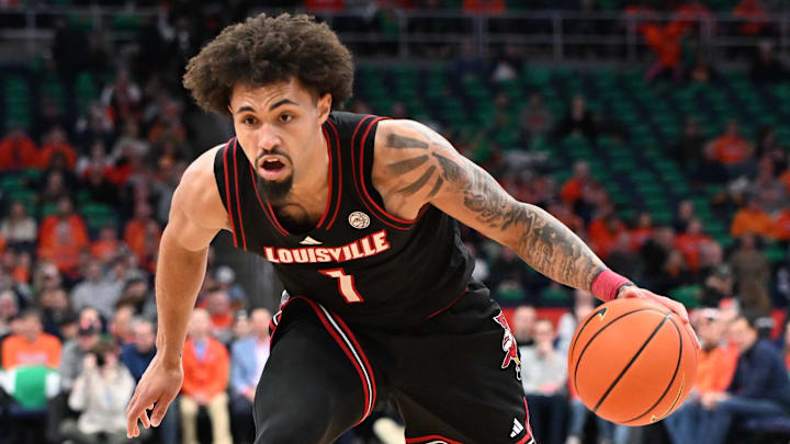 Jan 14, 2025; Syracuse, New York, USA; Louisville Cardinals guard J'Vonne Hadley (1) drives to the basket in the first half against the Syracuse Orange at the JMA Wireless Dome. 