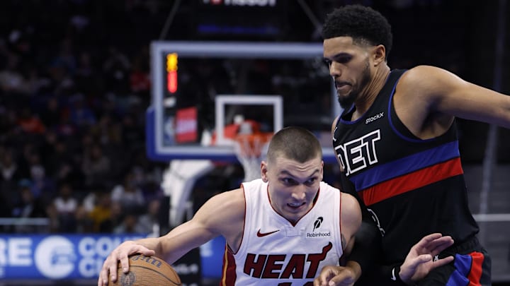 Nov 12, 2024; Detroit, Michigan, USA; Miami Heat guard Tyler Herro (14) dribbles defended by Detroit Pistons forward Tobias Harris (12) in the first half at Little Caesars Arena. Nov 12, 2024; Detroit, Michigan, USA; Miami Heat guard Tyler Herro (14) dribbles defended by Detroit Pistons forward Tobias Harris (12) in the first half at Little Caesars Arena.