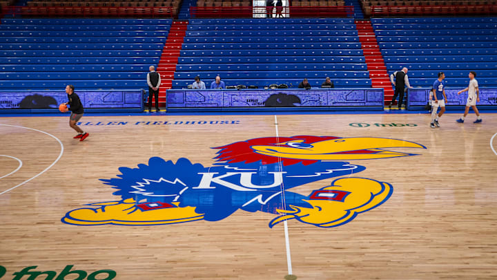 Mar 1, 2025; Lawrence, Kansas, USA; Kansas Jayhawks logo at center court prior to the game against the Texas Tech Red Raiders at Allen Fieldhouse. Mandatory Credit: William Purnell-Imagn Images
