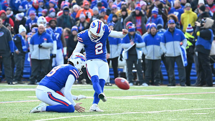 Jan 12, 2025; Orchard Park, New York, USA; Buffalo Bills place kicker Tyler Bass (2) kicks a field goal during the first quarter against the Denver Broncos in an AFC wild card game at Highmark Stadium. Mandatory Credit: Mark Konezny-Imagn Images