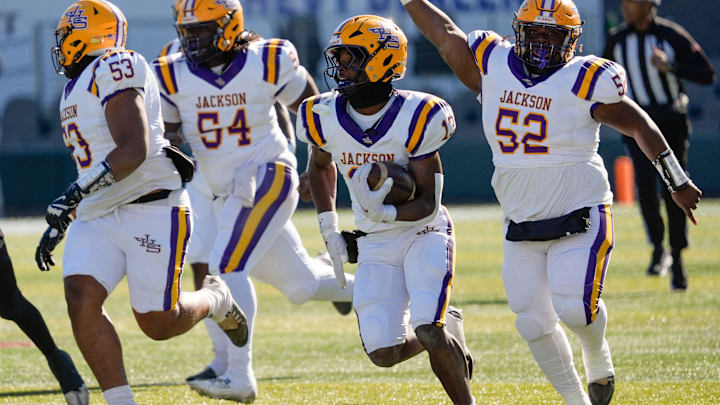 Jackson's Ezavier Crowell (13) breaks a long touchdown run on the Aggies’ first possession against Cherokee County at Protective Stadium in the AHSAA 4A State Championship game.