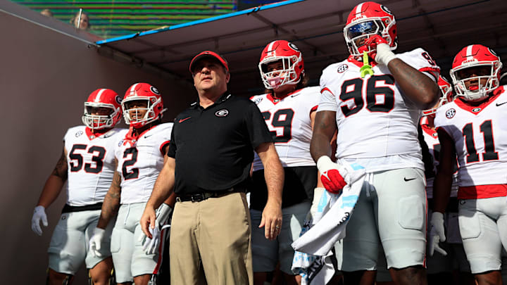 Georgia Bulldogs head coach Kirby Smart, center, prepares to lead, from left, offensive lineman Dylan Fairchild (53), running back Kendall Milton (2), offensive lineman Tate Ratledge (69), defensive lineman Zion Logue (96), and linebacker Jalon Walker (11) onto the field before an NCAA football game Saturday, Oct. 28, 2023 at EverBank Stadium in Jacksonville, Fla. Georgia defeated Florida 43-20. [Corey Perrine/Florida Times-Union]